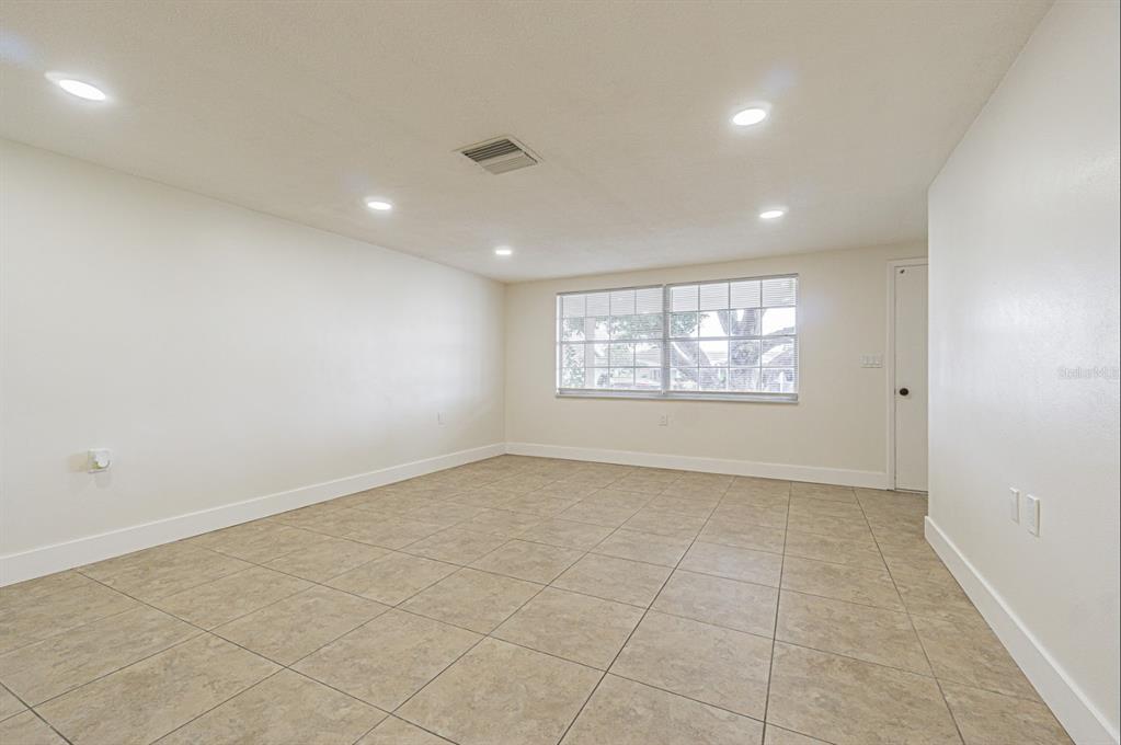 5631 Riddle Road Holiday, FL 34690 - Photo 5 of 27 an empty room with windows
