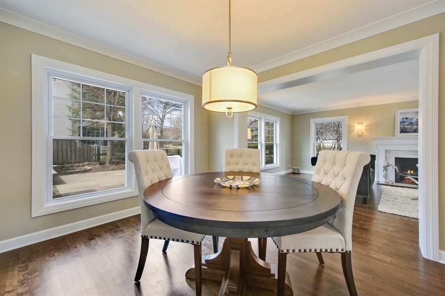 906 South County Line Road Hinsdale, IL 60521 - Photo 14 of 44 a view of a dining room with furniture window and wooden floor