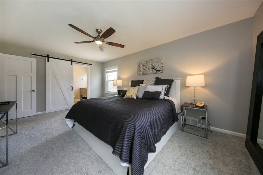 906 South County Line Road Hinsdale, IL 60521 - Photo 19 of 44 a bedroom with a bed and window