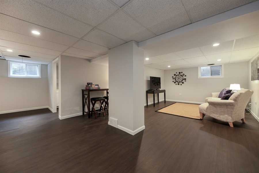 906 South County Line Road Hinsdale, IL 60521 - Photo 29 of 44 a living room with furniture and a wooden floor