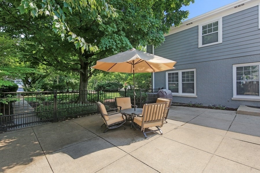 906 South County Line Road Hinsdale, IL 60521 - Photo 35 of 44 a view of backyard with seating space and wooden fence