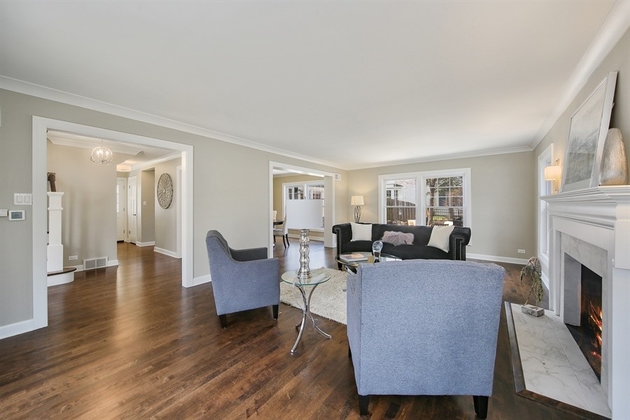906 South County Line Road Hinsdale, IL 60521 - Photo 4 of 44 a living room with furniture and a fireplace