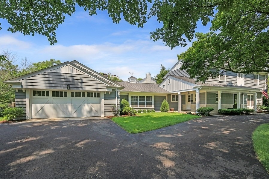 906 South County Line Road Hinsdale, IL 60521 - Photo 42 of 44 a front view of a house with a garden