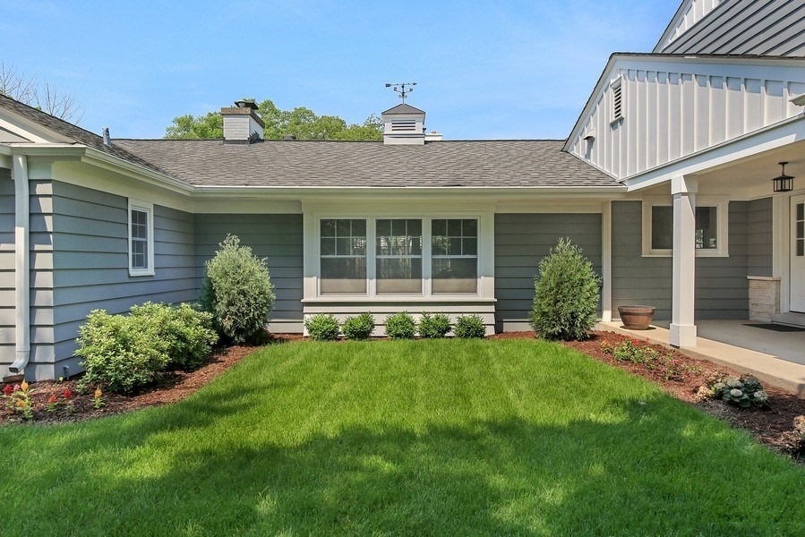 906 South County Line Road Hinsdale, IL 60521 - Photo 43 of 44 a front view of a house with a garden