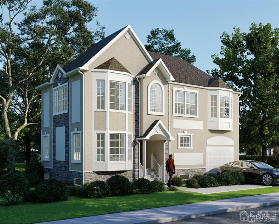 a front view of a house with a yard and trees