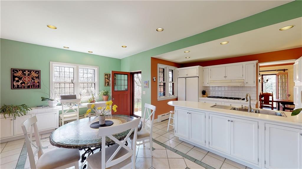5426 Darlington Road Pittsburgh, PA 15217 - Photo 12 of 24 a kitchen with stainless steel appliances kitchen island granite countertop a sink and cabinets