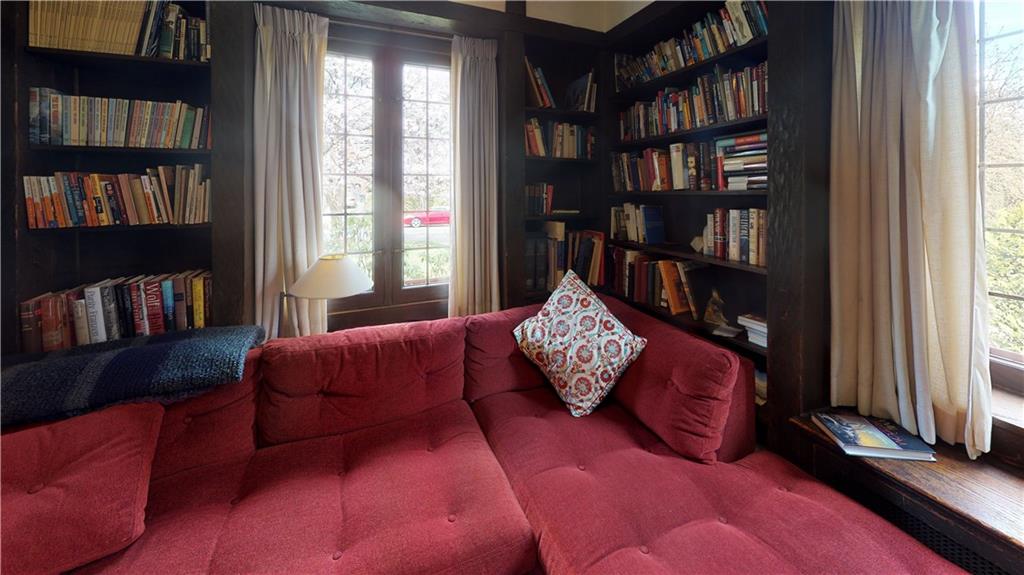 5426 Darlington Road Pittsburgh, PA 15217 - Photo 15 of 24 a living room with furniture book shelf and a window