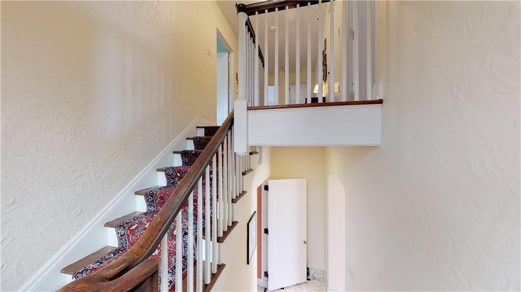 5426 Darlington Road Pittsburgh, PA 15217 - Photo 16 of 24 a view of staircase with wooden floor and white walls