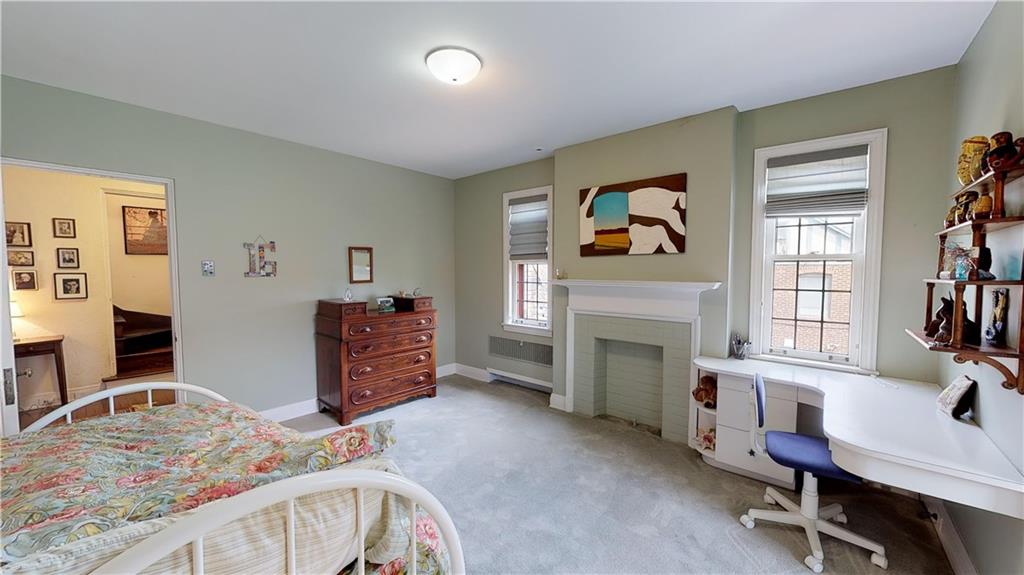5426 Darlington Road Pittsburgh, PA 15217 - Photo 17 of 24 a bedroom with furniture and a fireplace