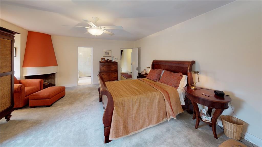 5426 Darlington Road Pittsburgh, PA 15217 - Photo 19 of 24 a bedroom with a bed and a lamp