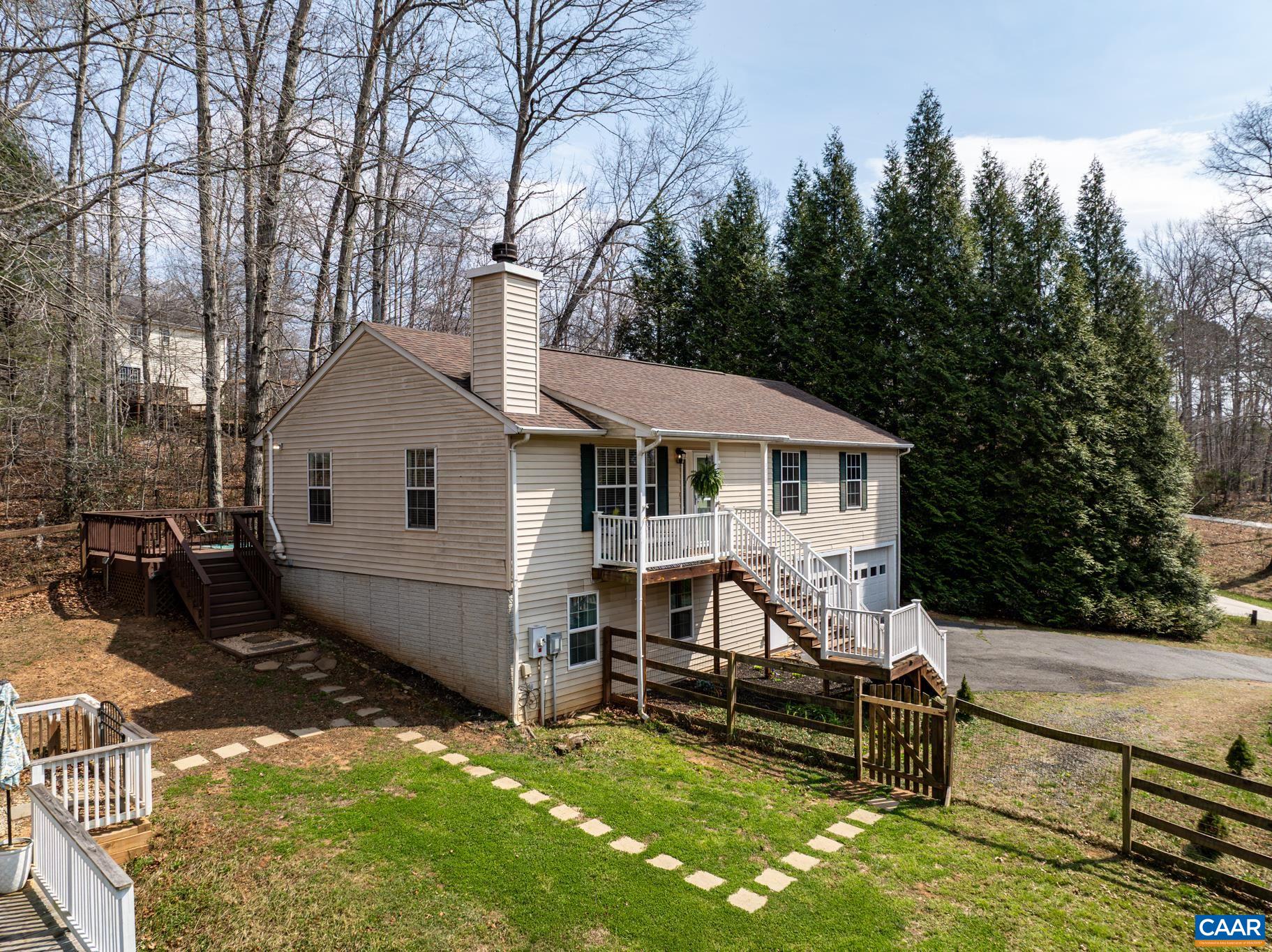 1029 West Daffodil Road Ruckersville, VA 22968 - Photo 3 of 39 a view of a house with backyard and sitting area