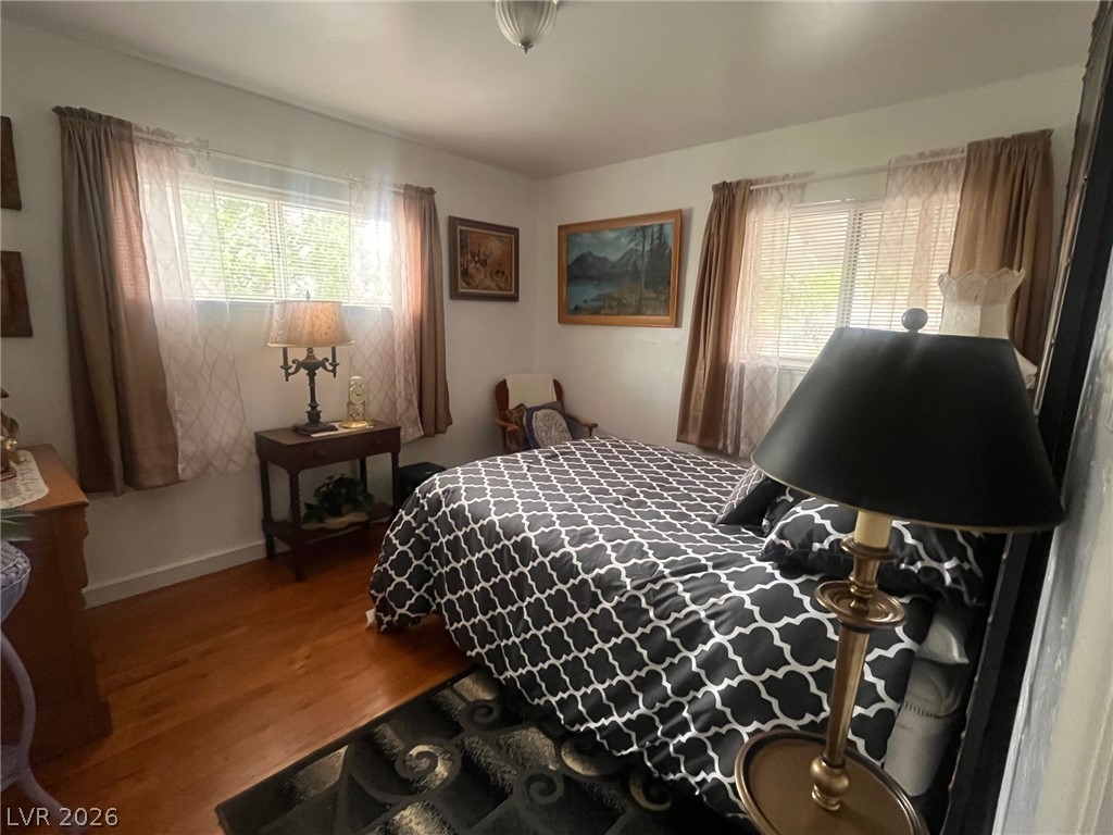 12 Reno Road Ely, NV 89301 - Photo 7 of 21 Bedroom featuring wood finished floors and multiple windows