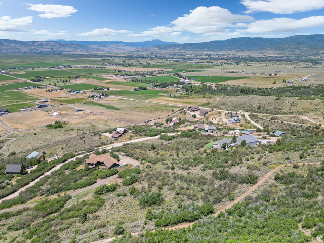 2459 Painter Road Marion, UT 84036 - Photo 26 of 42 Expansive aerial perspective showcasing a rural landscape with scattered residential properties