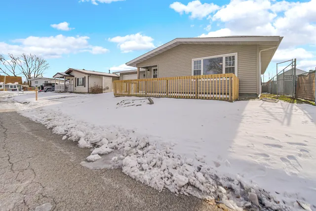 a view of a house with wooden fence