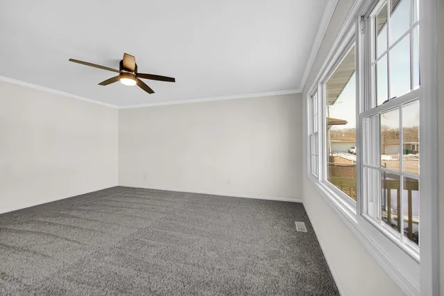 a view of a hallway with a window