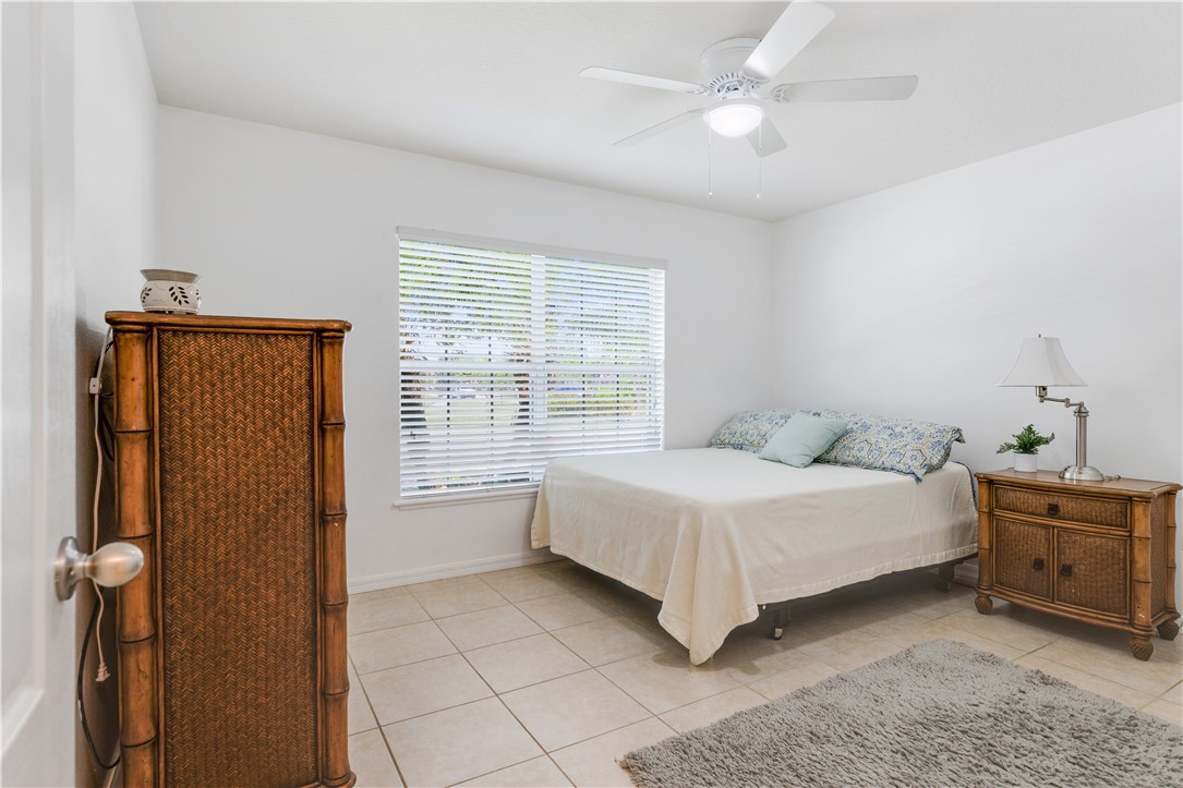 402 Lexington Avenue Southwest Vero Beach, FL 32962 - Photo 21 of 33 a bedroom with a bed and a cabinets