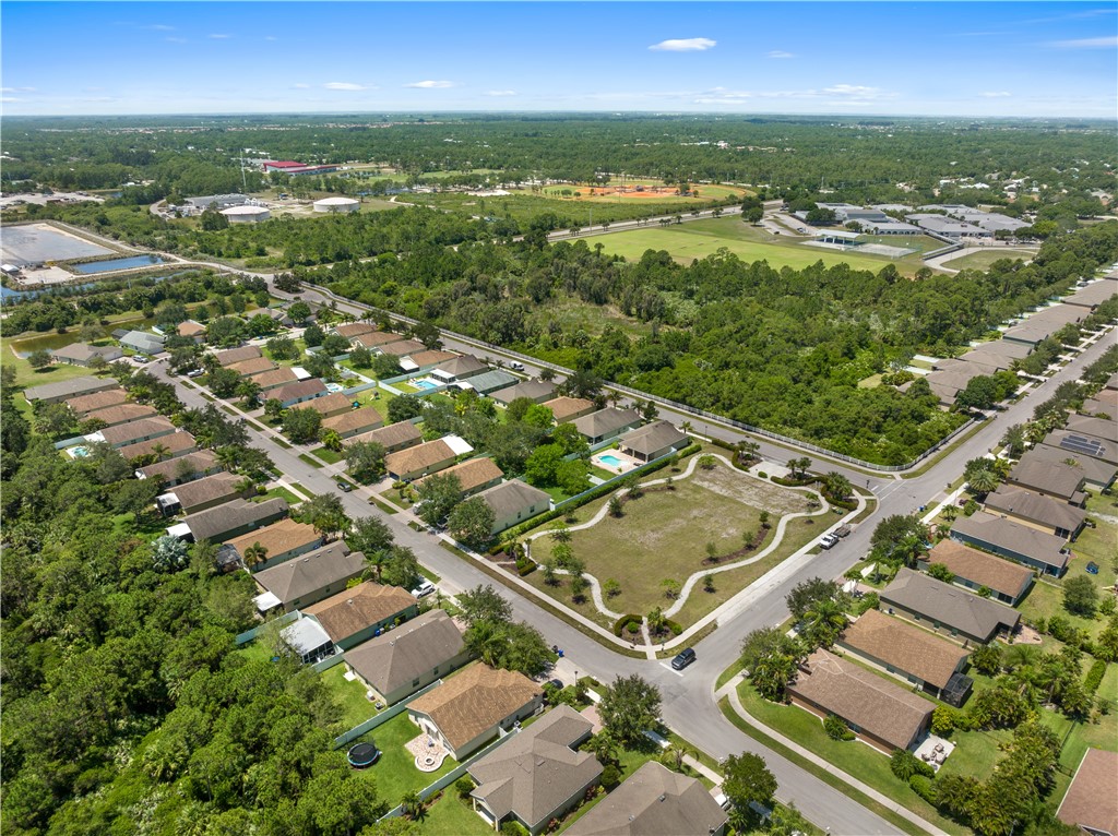 402 Lexington Avenue Southwest Vero Beach, FL 32962 - Photo 31 of 33 an aerial view of residential houses with outdoor space