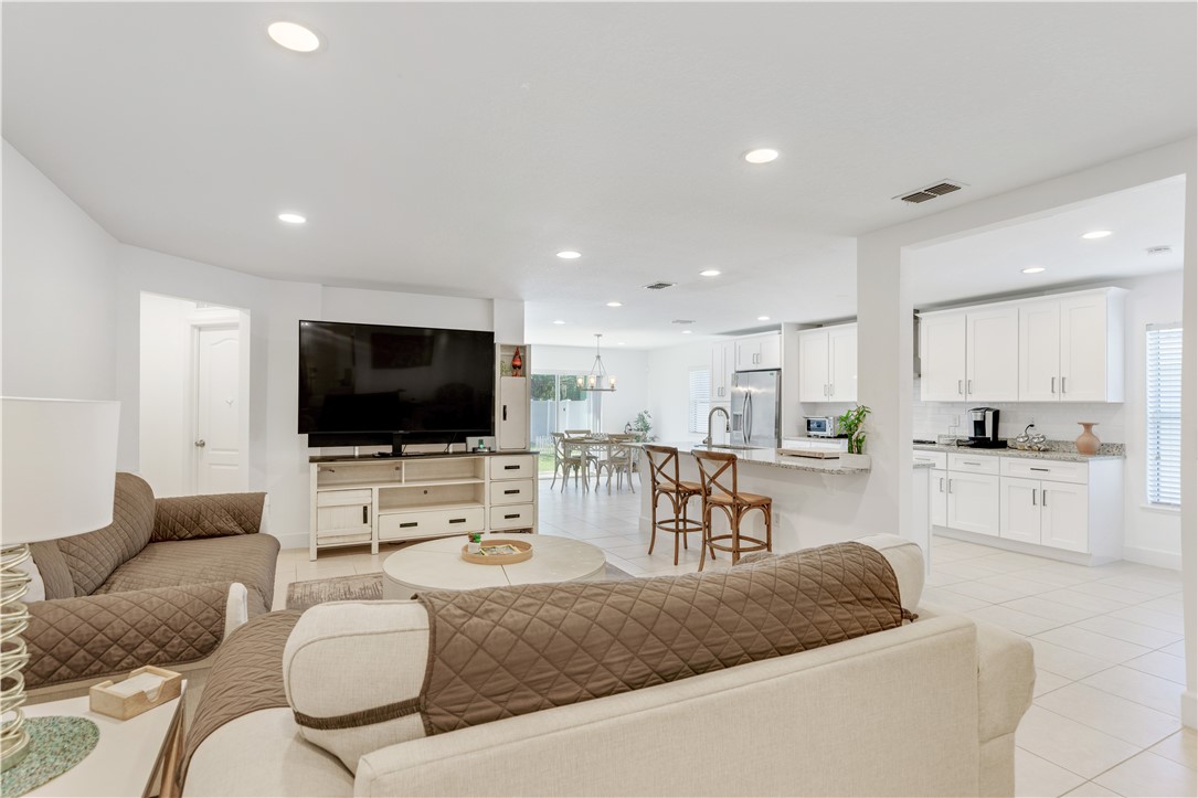402 Lexington Avenue Southwest Vero Beach, FL 32962 - Photo 6 of 33 a living room with furniture and a flat screen tv