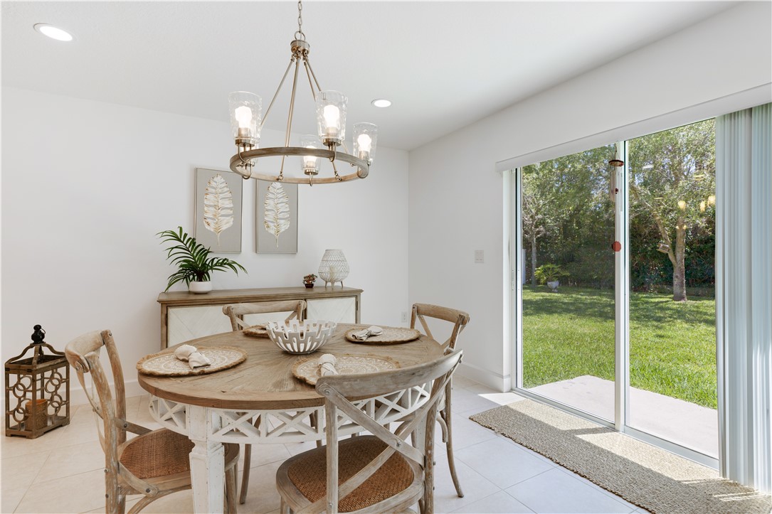 402 Lexington Avenue Southwest Vero Beach, FL 32962 - Photo 8 of 33 a view of a dining room with furniture window and outside view