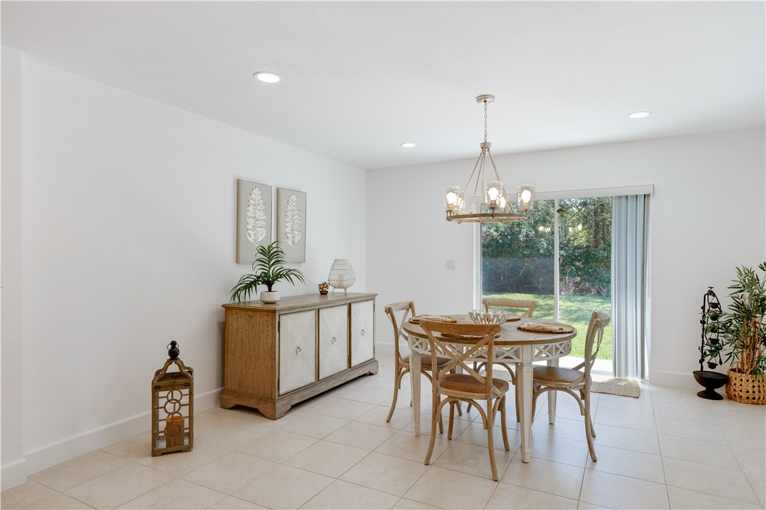 402 Lexington Avenue Southwest Vero Beach, FL 32962 - Photo 9 of 33 a dining room filled with furniture and window