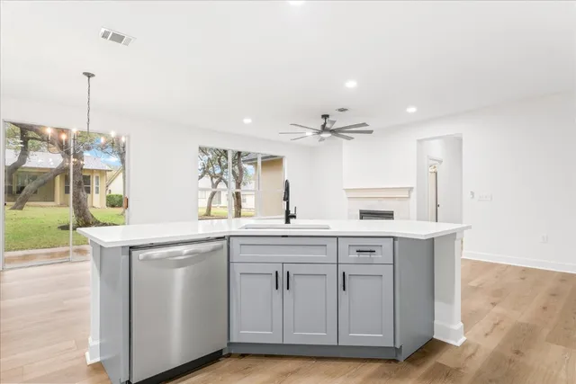 a kitchen with cabinets and sink