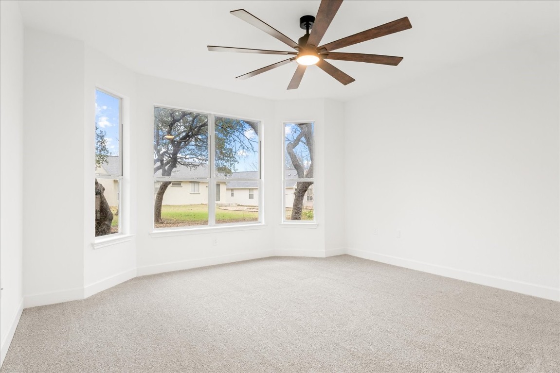 151 Dan Moody Trail Georgetown, TX 78633 - Photo 21 of 31 an empty room with a window and a ceiling fan