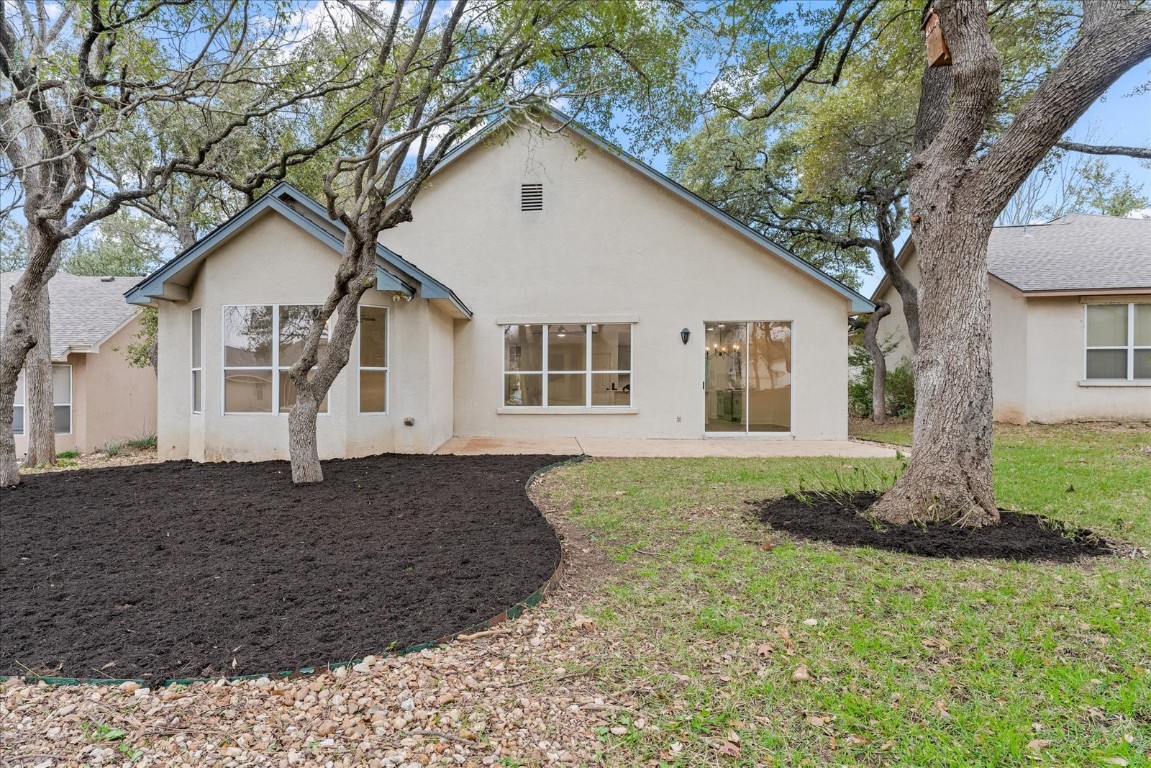 151 Dan Moody Trail Georgetown, TX 78633 - Photo 30 of 31 a front view of a house with a yard