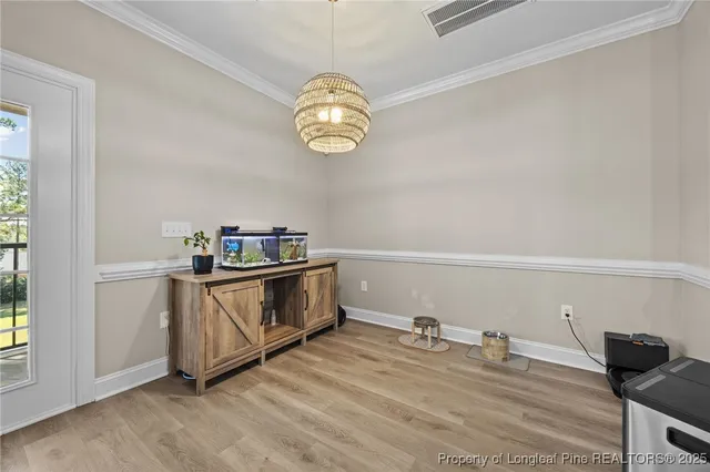 a view of kitchen and cabinets