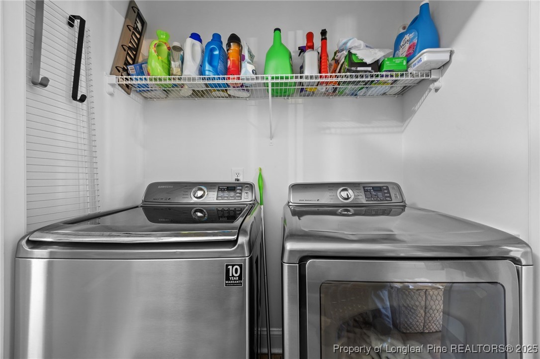 62 Gallery Drive, Unit 302 Spring Lake, NC 28390 - Photo 23 of 34 a utility room with dryer and washer
