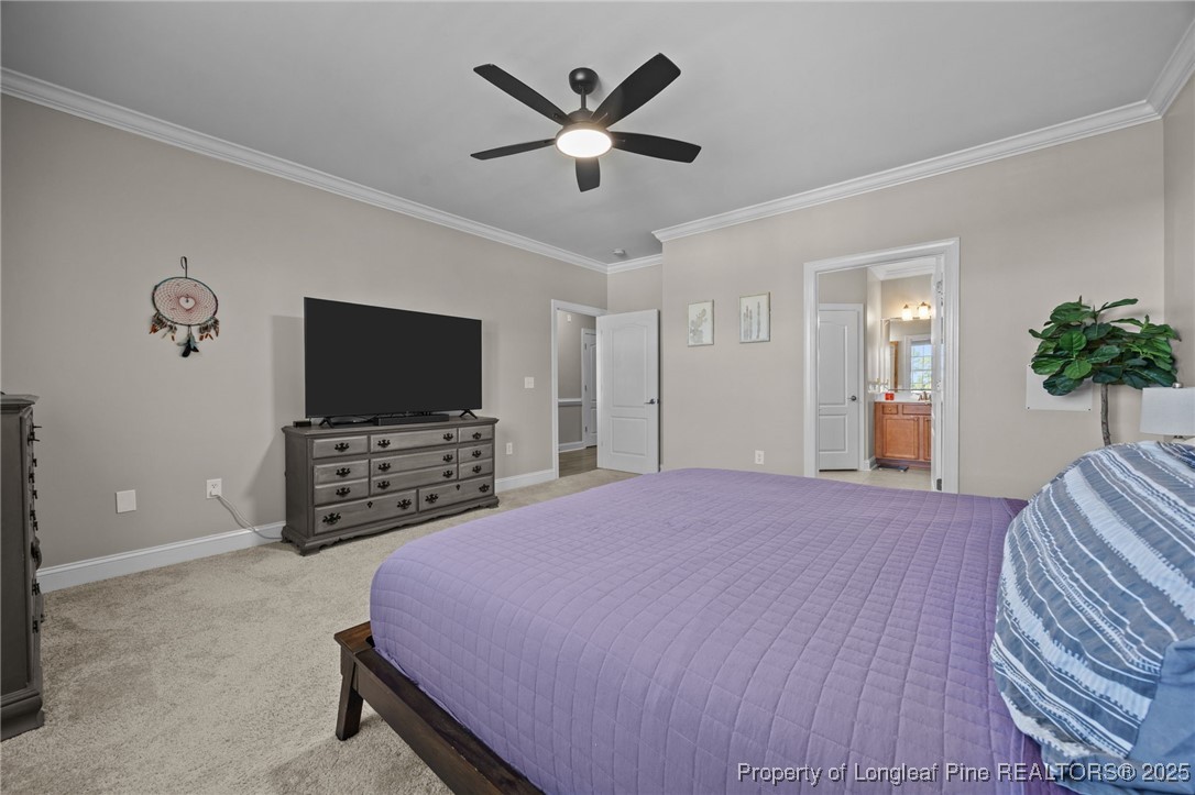 62 Gallery Drive, Unit 302 Spring Lake, NC 28390 - Photo 26 of 34 a bedroom with a bed and a flat screen tv