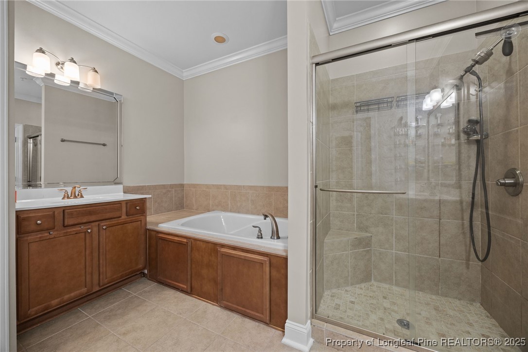 62 Gallery Drive, Unit 302 Spring Lake, NC 28390 - Photo 27 of 34 a bathroom with a tub a sink shower and mirror