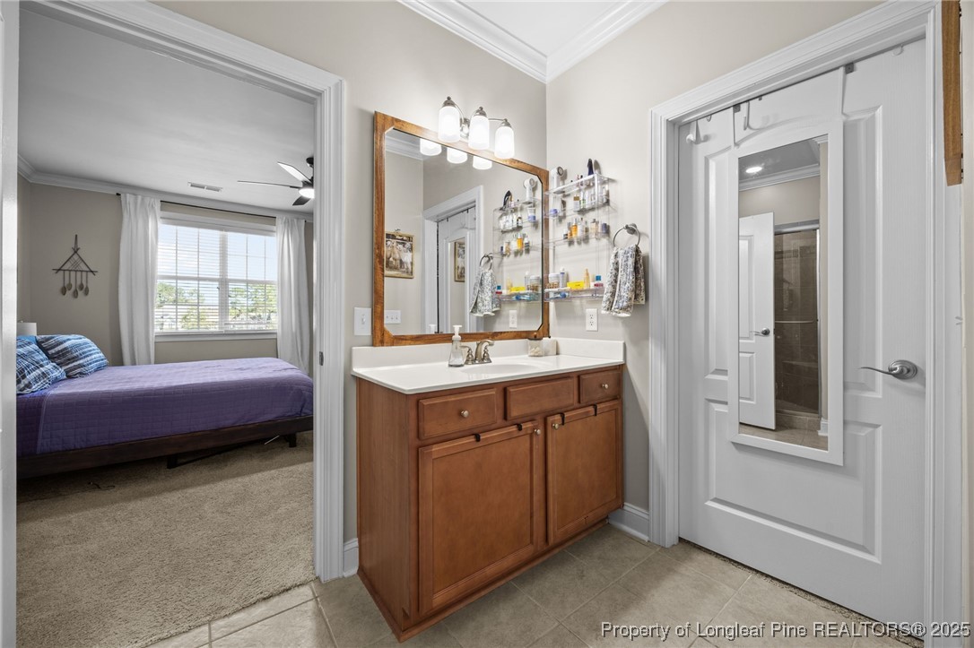 62 Gallery Drive, Unit 302 Spring Lake, NC 28390 - Photo 28 of 34 a spacious bathroom with a shower sink and mirror