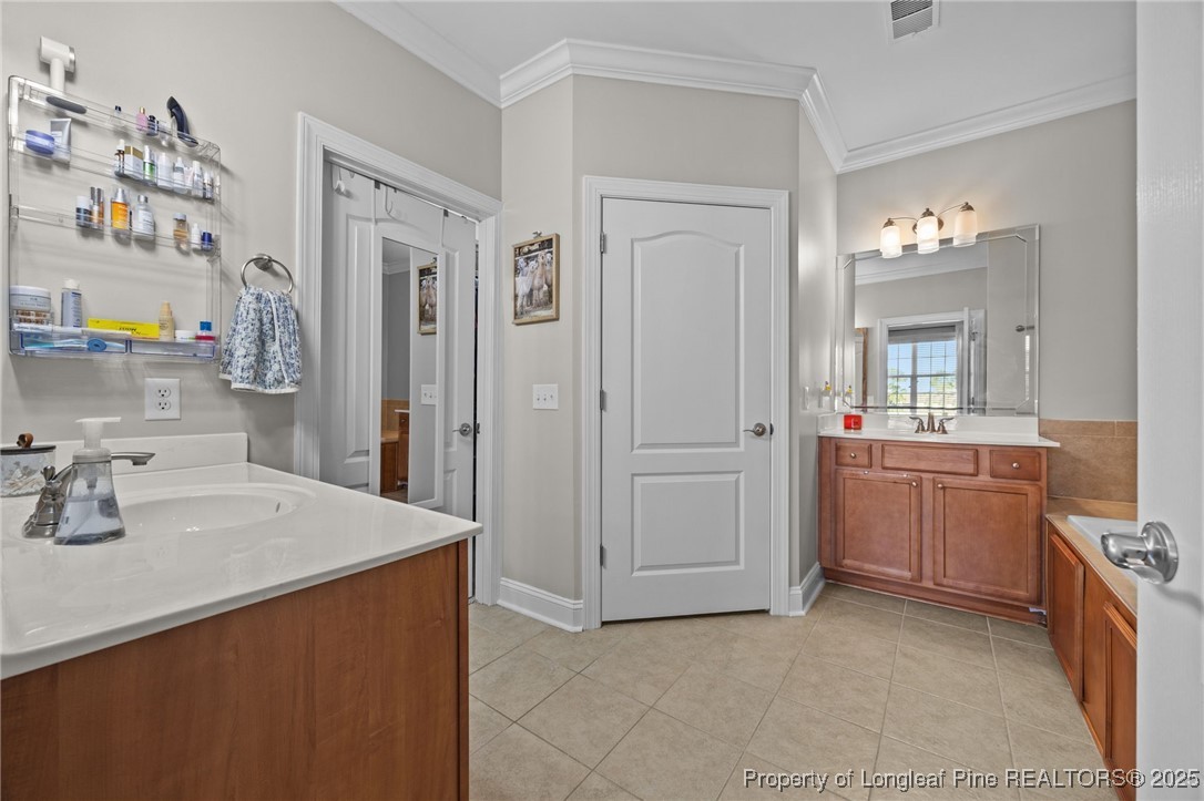 62 Gallery Drive, Unit 302 Spring Lake, NC 28390 - Photo 29 of 34 a kitchen with a sink and cabinets