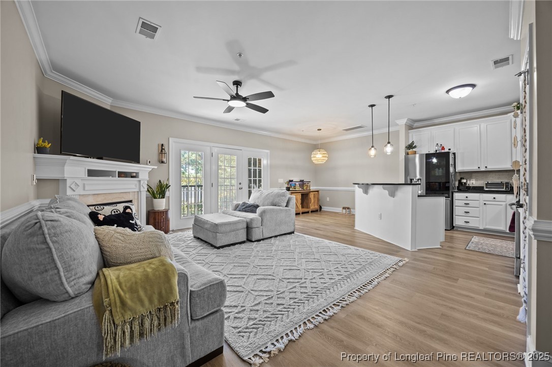 62 Gallery Drive, Unit 302 Spring Lake, NC 28390 - Photo 8 of 34 a living room with furniture and a flat screen tv