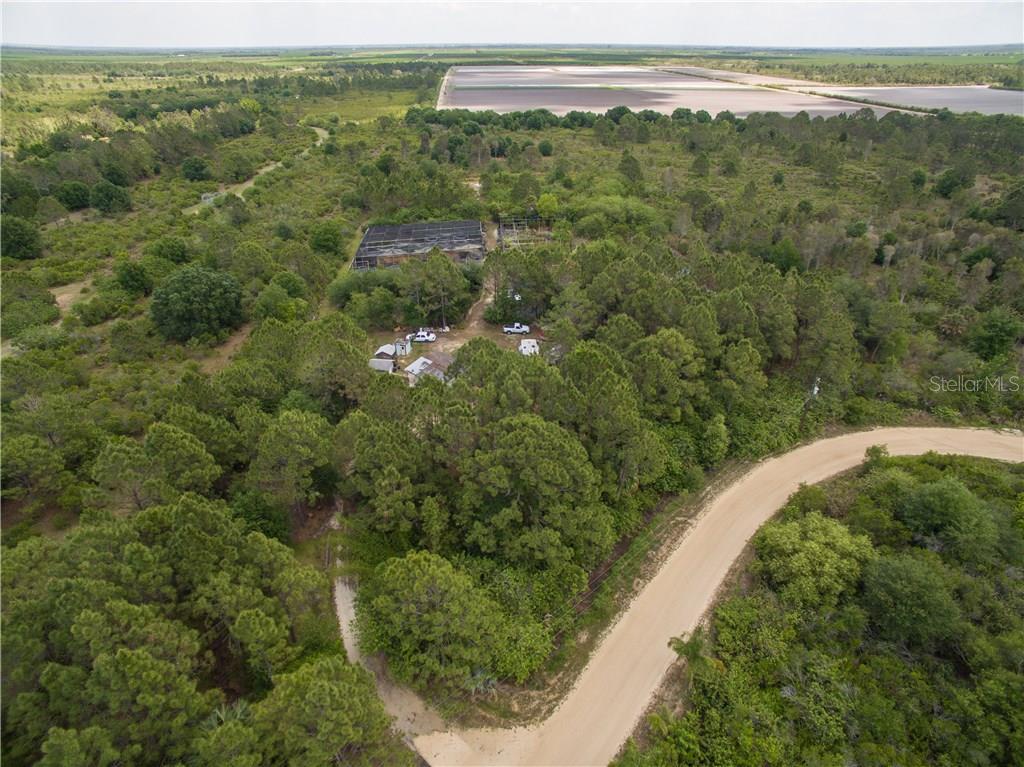 47250 Bermont Road Punta Gorda, FL 33982 - Photo 1 of 1 a view of a city with lush green forest