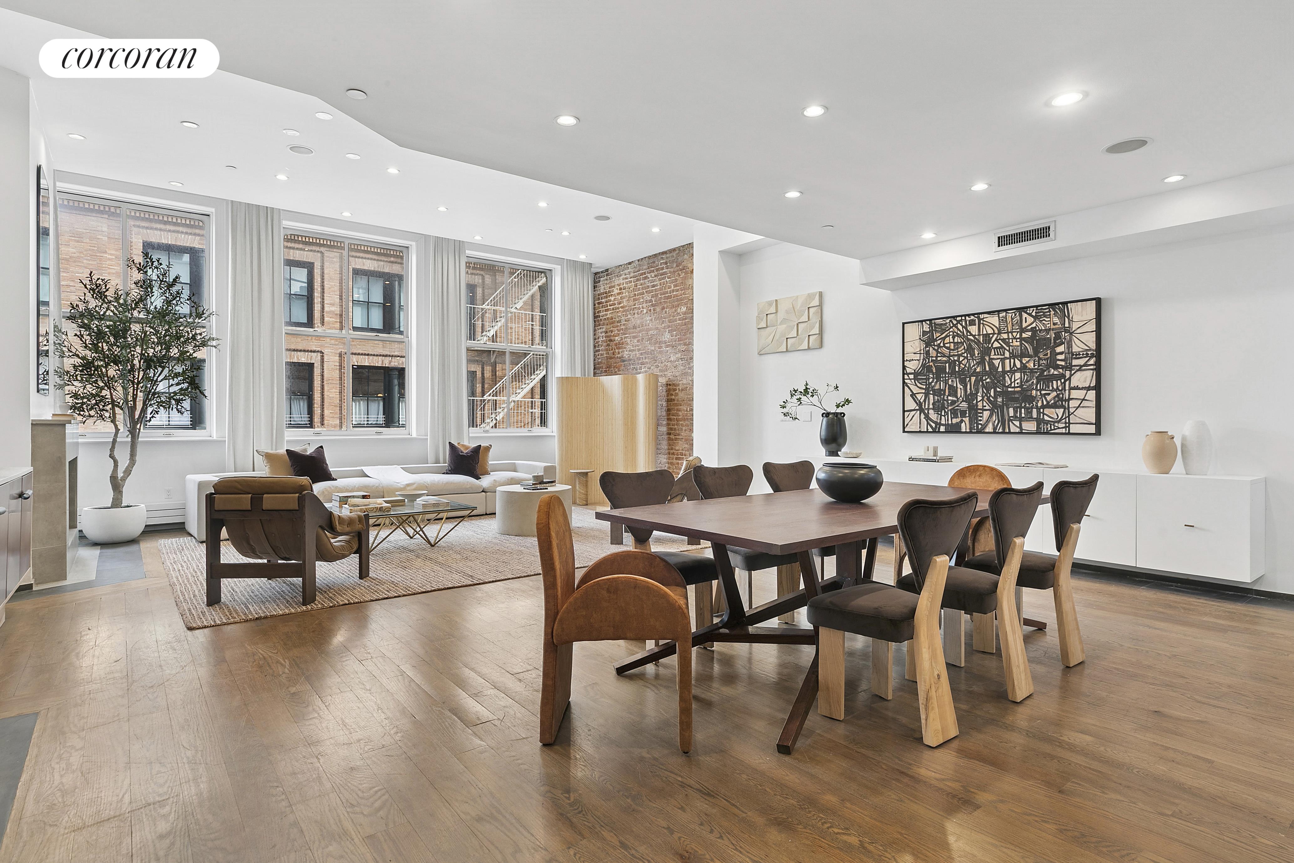 46 Lispenard Street, Unit 5E Manhattan, NY 10013 - Photo 2 of 8 a view of a dining room with furniture window and wooden floor