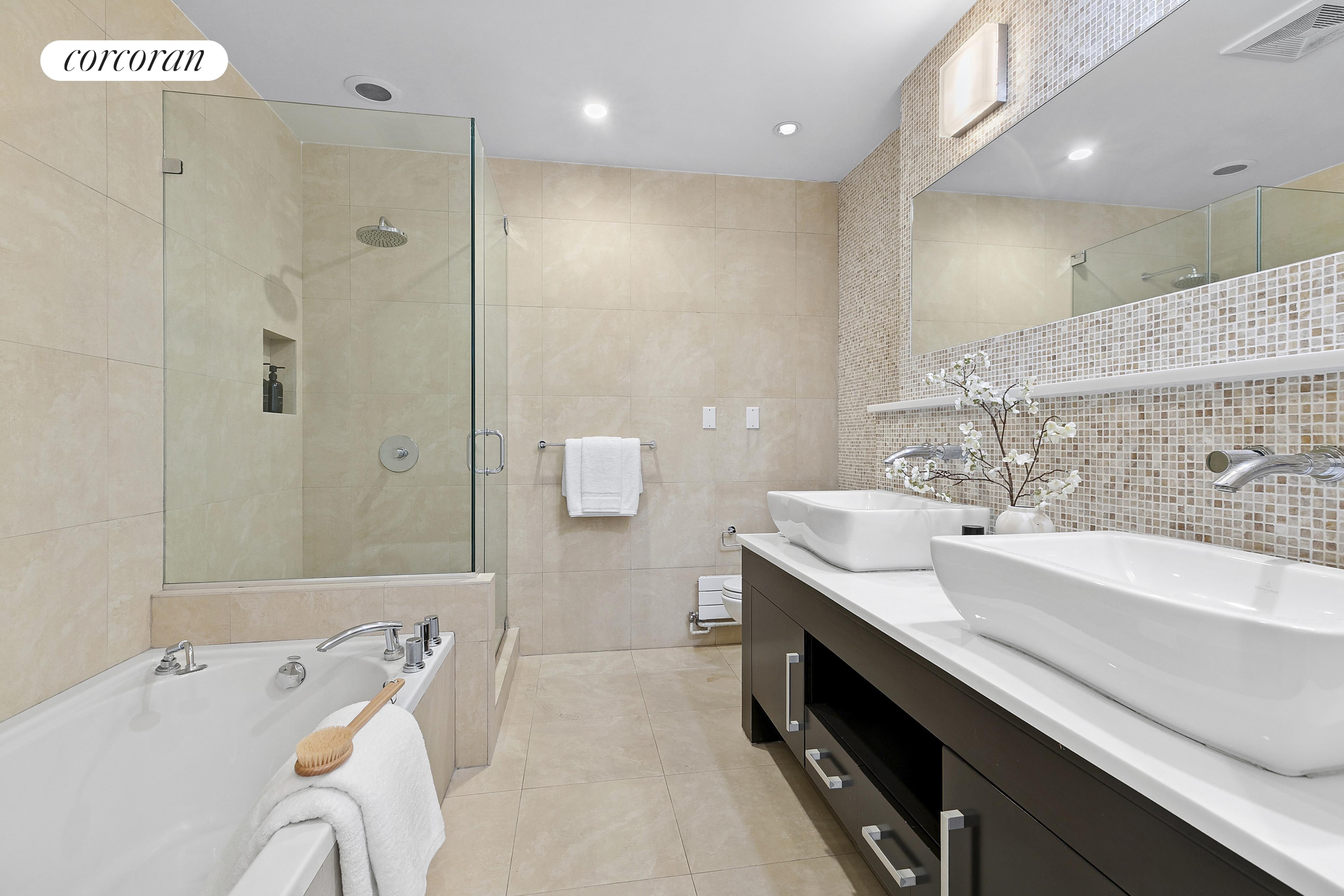 46 Lispenard Street, Unit 5E Manhattan, NY 10013 - Photo 5 of 8 a spacious bathroom with a double vanity sink mirror and double