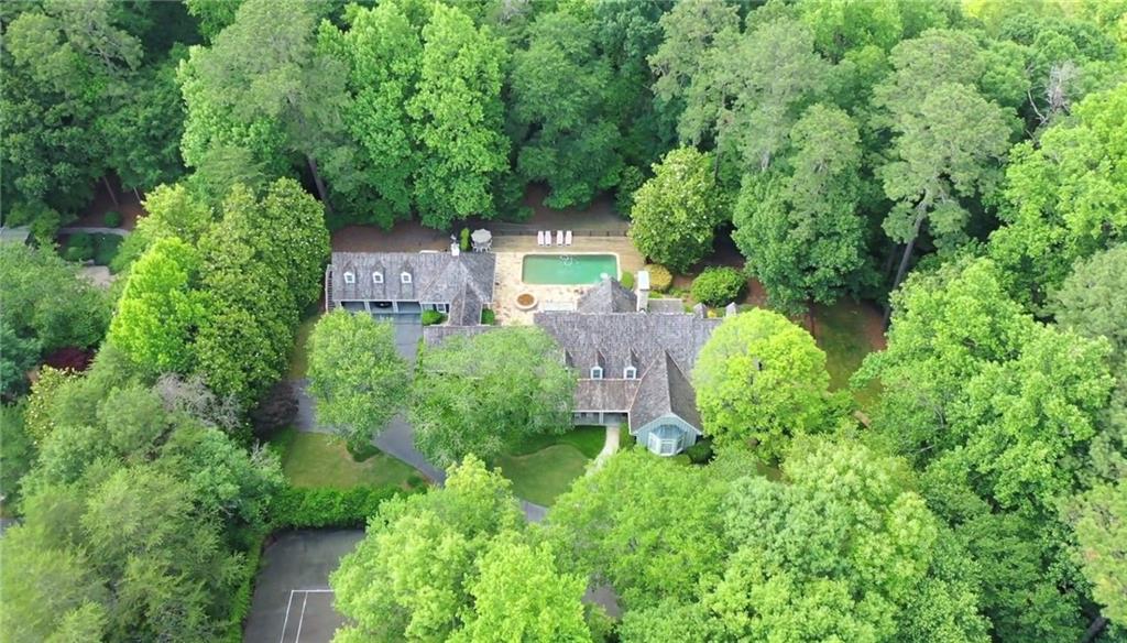 1405 North Harris Ridge Northwest Atlanta, GA 30327 - Photo 1 of 1 Over 2 acres with pool plus tennis court backing to the Chattahoochee River national forest which can never be built on allowing for permanent privacy!