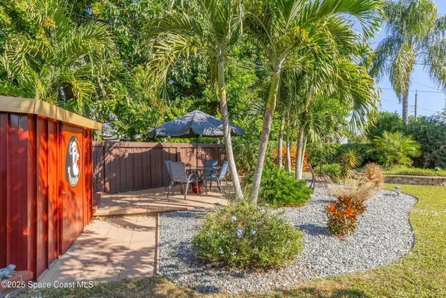 a view of a backyard with swimming pool