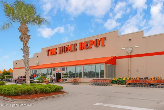 a view of a street with stores