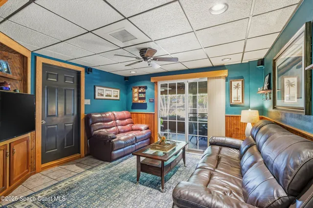 a outdoor living space with furniture and a floor to ceiling window