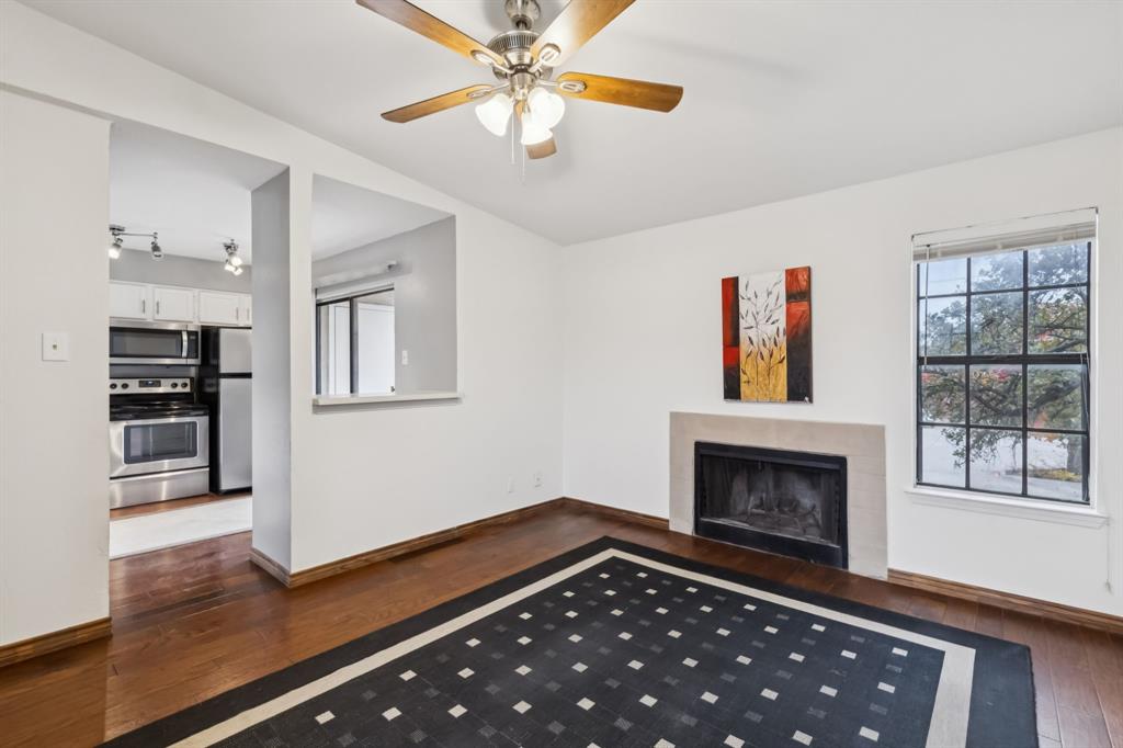 4748 Old Bent Tree Lane, Unit 1808 Dallas, TX 75287 - Photo 1 of 28 a room with furniture and a fireplace