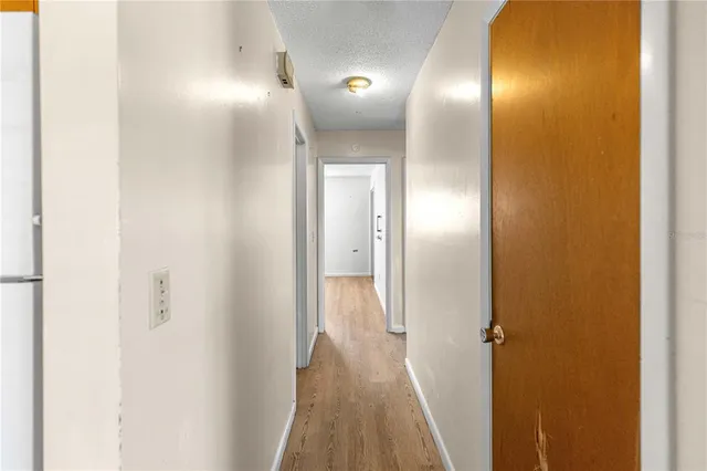 a view of a bathroom from a hallway