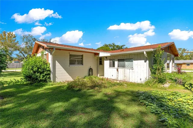a view of backyard with a garden and plants