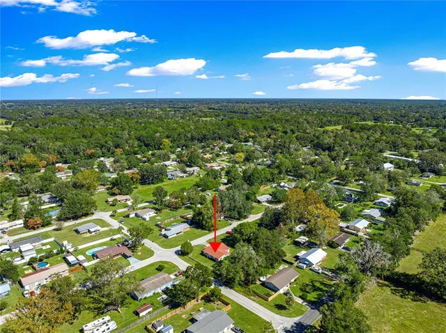 a view of a yard with swimming pool