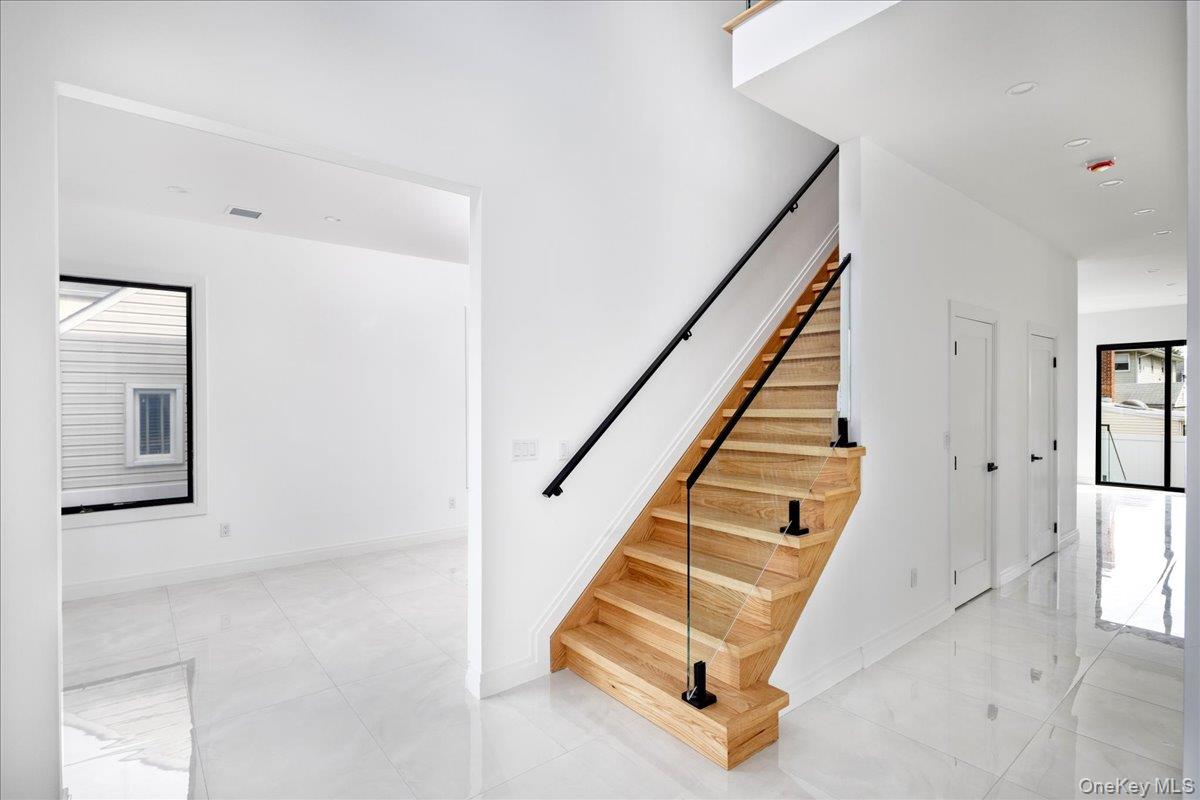 544 Arlington Road Cedarhurst, NY 11516 - Photo 5 of 38 a view of entryway and hall with wooden floor