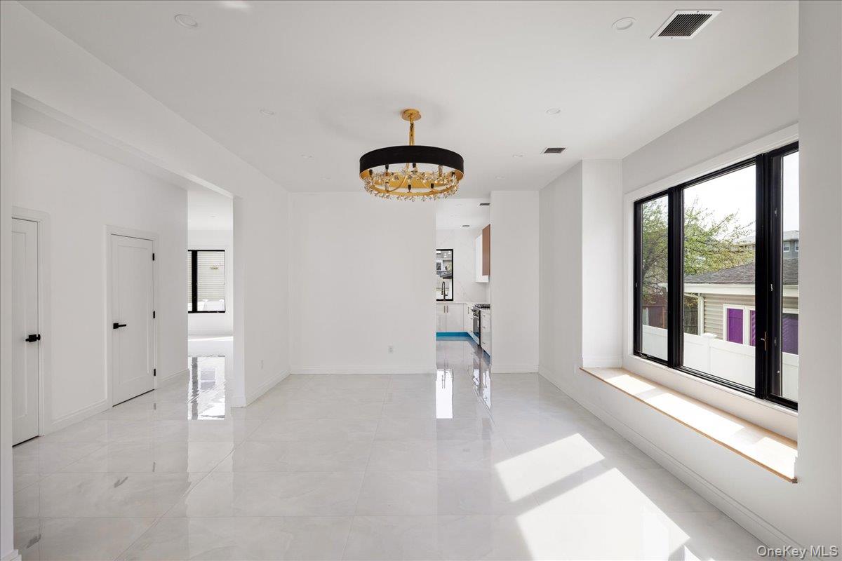 544 Arlington Road Cedarhurst, NY 11516 - Photo 8 of 38 a view of an empty room with a window