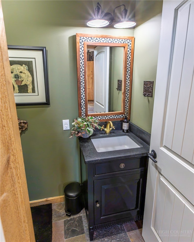 509 Grant Houck Road Todd, NC 28684 - Photo 21 of 43 a bathroom with a sink and a mirror