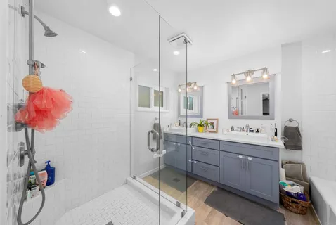 a room with a sink desk and chairs