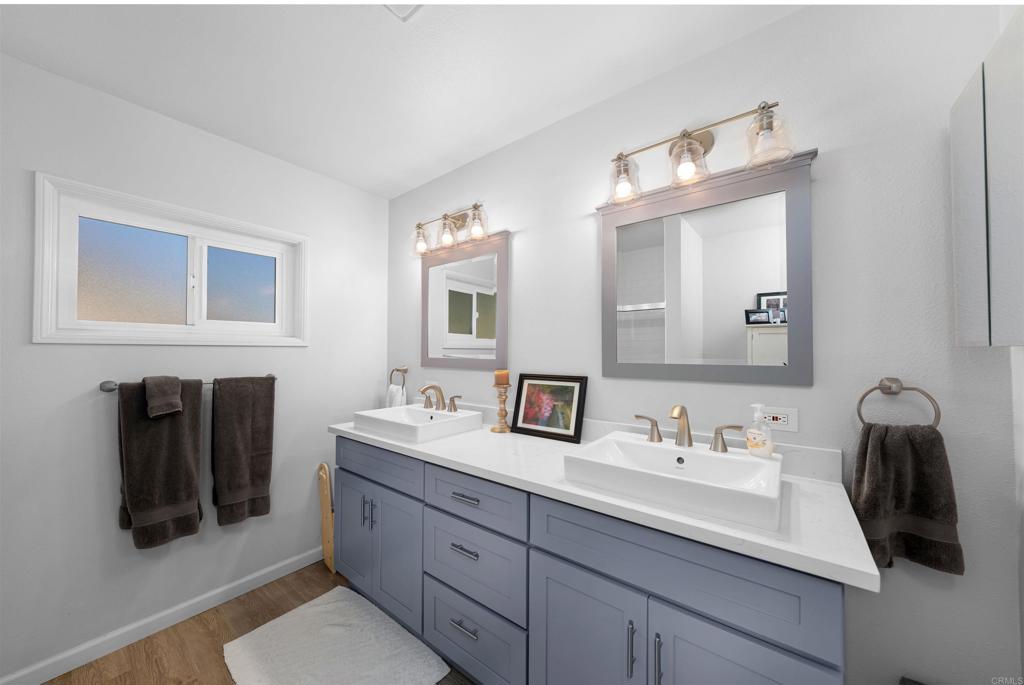 1358 Sundale Road El Cajon, CA 92019 - Photo 15 of 25 a bathroom with a sink and a mirror